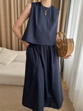 xakxx Loose Solid Color Round-Neck Vest + High Waisted  Skirt Two Pieces Set